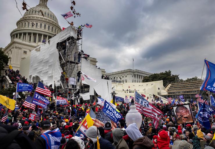 Supporters of President Donald Trump clash with police and security forces as they try to storm the U.S. Capitol on Jan. 6, 2021. The mob forced its way into the Capitol as Congress met to certify the 2020 Electoral College count.