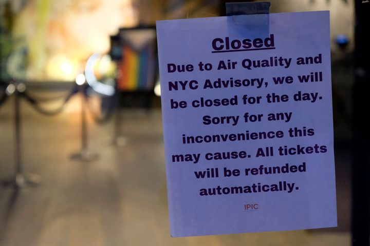 A sign is displayed on the door of an IPIC theatre explaining that it is closed due to air quality in New York on Wednesday, June 7, 2023.