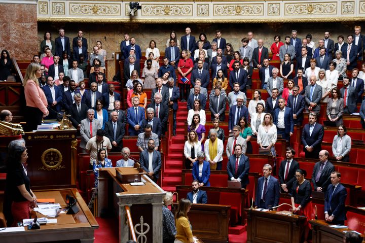 French MPs stand for a minute of silence after a knife attack in Annecy, during a session of questions during a debate in Paris, on June 8, 2023. 