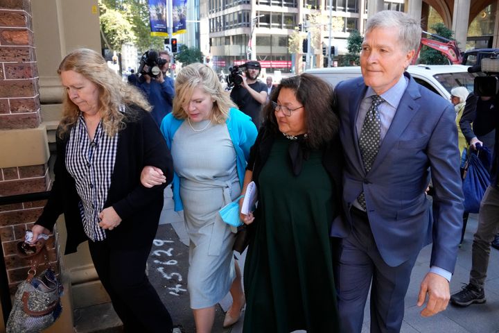 Steve Johnson, right, with his sisters, Terry, left, and Rebecca, and his wife Rosemarie, second right, arrive at the Supreme Court in Sydney in May 2022 for a sentencing hearing in the murder of their brother Scott Johnson.