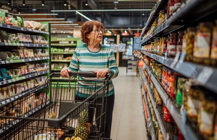 Senior woman shopping groceries in the supermarket