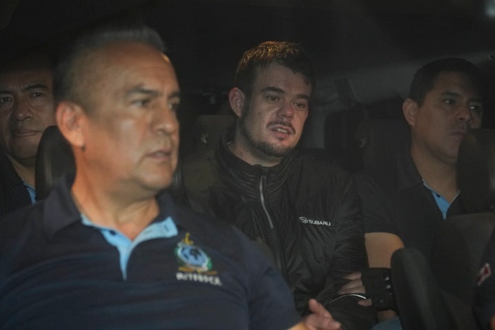 Dutch citizen Joran van der Sloot, center, is driven in a police vehicle from the Ancon I maximum-security prison, outskirts of Lima, Peru, Thursday, June 8, 2023. The main suspect in the unsolved 2005 disappearance of American student Natalee Holloway on the Caribbean island of Aruba is expected to be extradited Thursday from Peru to the United States. (AP Photo/Martin Mejia)