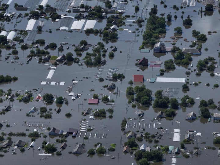 Houses are seen underwater in the flooded village of Dnipryany.