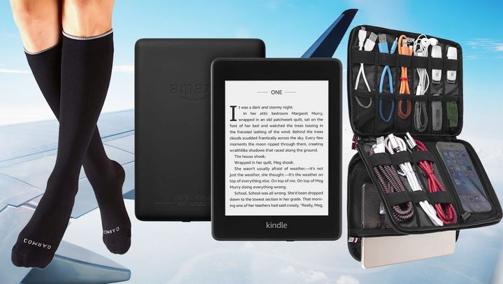 A pair of tall compression socks, a Kindle and an electronic accessories organizer. 