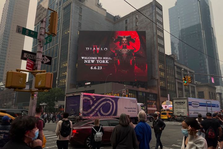 A billboard appears through a smoky haze caused by Canadian wildfires on June 7, 2023, in New York.
