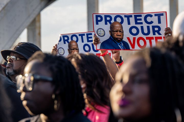 People march across the Edmund Pettus Bridge, the site of the 1965 march from Selma to Montgomery, Alabama, that led to the passage of the Voting Rights Act.