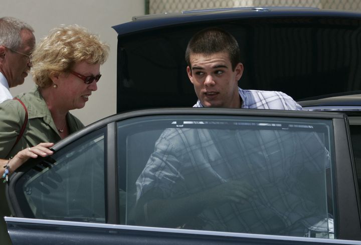Joran van der Sloot, then 18, enters his family's car as his mother Anita closes the door after he was conditionally released from jail in San Nicolas, Aruba, on Sept. 3, 2005. 