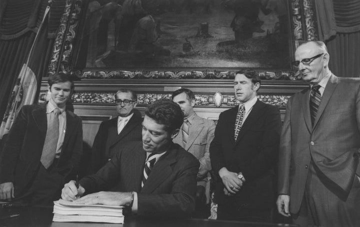 Then-Minnesota Gov. Wendell "Wendy" Anderson (DFL), seated, signs a tax and education funding reform bill in 1971. The contemporary DFL is more racially diverse.