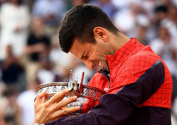Tennis - French Open - Roland Garros, Paris, France - June 11, 2023 Serbia's Novak Djokovic celebrates with the trophy after winning the French Open REUTERS/Lisi Niesner
