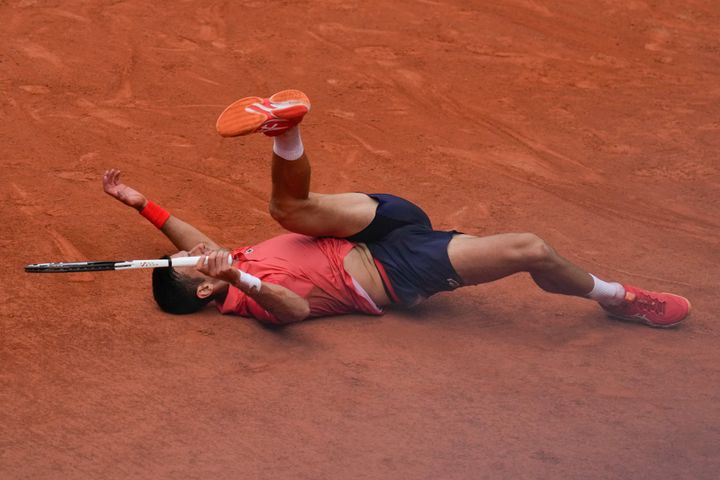 Serbia's Novak Djokovic slips on the clay court during the men's singles final match of the French Open tennis tournament against Norway's Casper Ruud at the Roland Garros stadium in Paris, Sunday, June 11, 2023. (AP Photo/Thibault Camus)