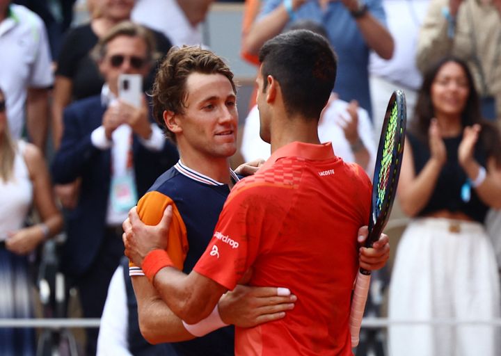 Tennis - French Open - Roland Garros, Paris, France - June 11, 2023 Serbia's Novak Djokovic consoles Norway's Casper Ruud after winning the final REUTERS/Lisi Niesner