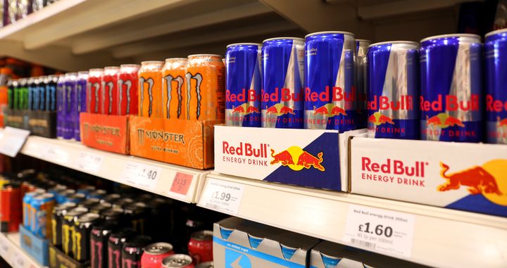 Red Bull and Monster energy drinks sit on display at a Sainsbury's store in London.