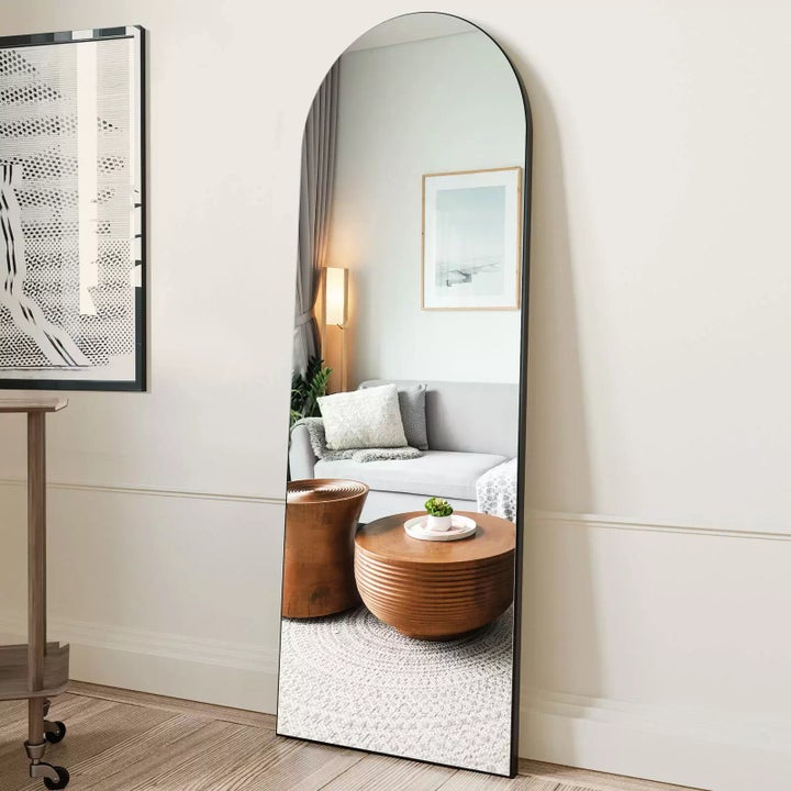 Beautypeak arched full-length standing <a href="https://goto.walmart.com/c/2706071/565706/9383?veh=aff&sourceid=imp_000011112222333344&u=https%3A%2F%2Fwww.walmart.com%2Fip%2FBEAUTYPEAK-Arched-Full-Length-Floor-Mirror-64-x21-1-Full-Body-Standing-Mirror-Black%2F414919150&subId1=64875546e4b025003edf0305" target="_blank" data-affiliate="true" role="link" rel="sponsored" class=" js-entry-link cet-external-link" data-vars-item-name="mirror" data-vars-item-type="text" data-vars-unit-name="64875546e4b025003edf0305" data-vars-unit-type="buzz_body" data-vars-target-content-id="https://goto.walmart.com/c/2706071/565706/9383?veh=aff&sourceid=imp_000011112222333344&u=https%3A%2F%2Fwww.walmart.com%2Fip%2FBEAUTYPEAK-Arched-Full-Length-Floor-Mirror-64-x21-1-Full-Body-Standing-Mirror-Black%2F414919150&subId1=64875546e4b025003edf0305" data-vars-target-content-type="url" data-vars-type="web_external_link" data-vars-subunit-name="article_body" data-vars-subunit-type="component" data-vars-position-in-subunit="0">mirror</a>.