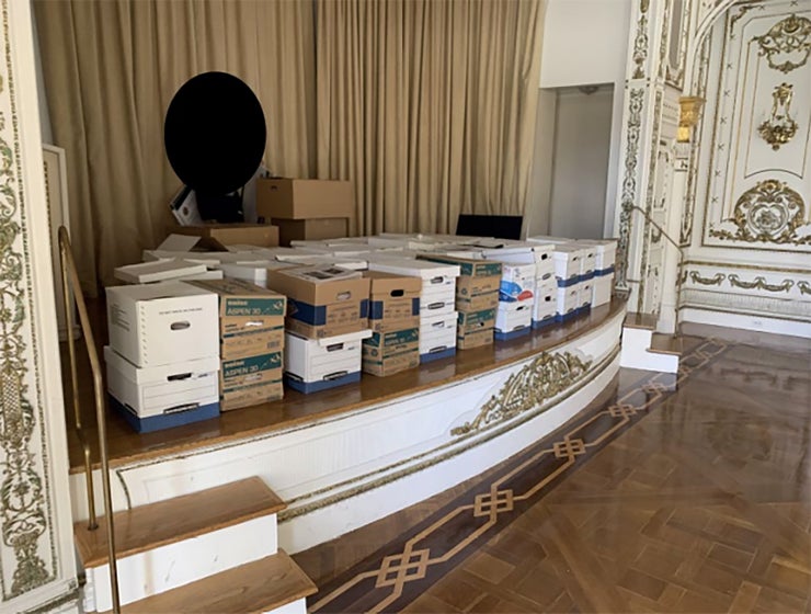 In this Department of Justice photo, boxes are stacked in the White and Gold Ballroom of Trump's Mar-a-Lago estate in Florida.