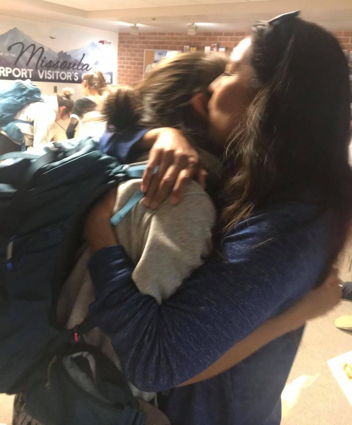 Westwolf hugs her mother at the airport upon her return home from Nepal.