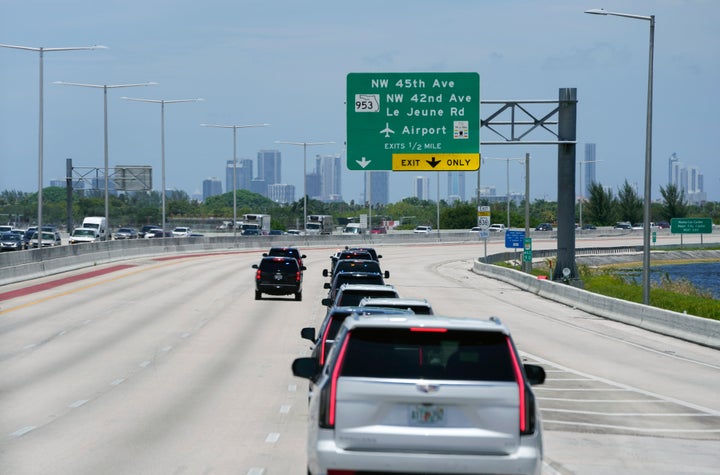 The motorcade for former President Donald Trump drives along the Dolphin Expressway, Tuesday, June 13, 2023, in Miami.