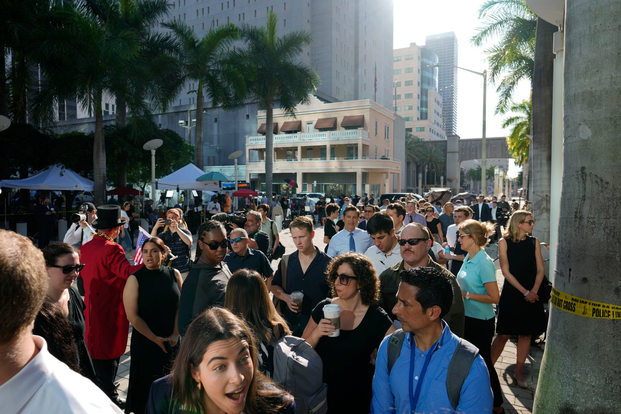 Journalists line up to be admitted inside the Wilkie D. Ferguson Jr. courthouse.