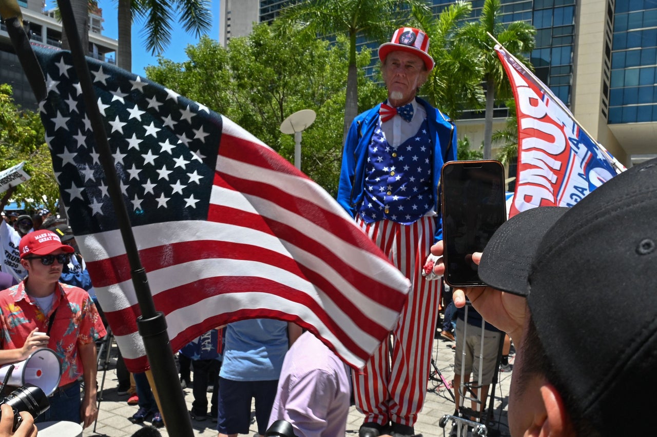 Onlookers gather outside the courthouse on June 13.