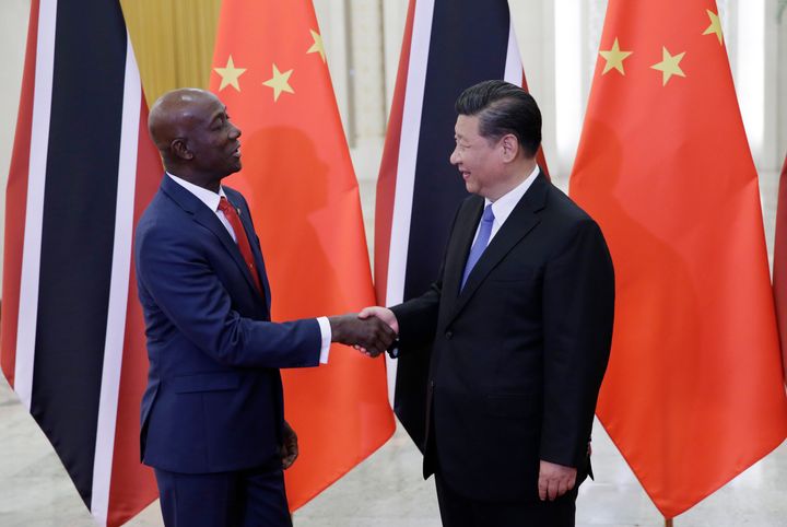China's President Xi Jinping (right) meets Trinidad and Tobago Prime Minister Keith Rowley at the Great Hall of the People on May 15, 2018, in Beijing, China.