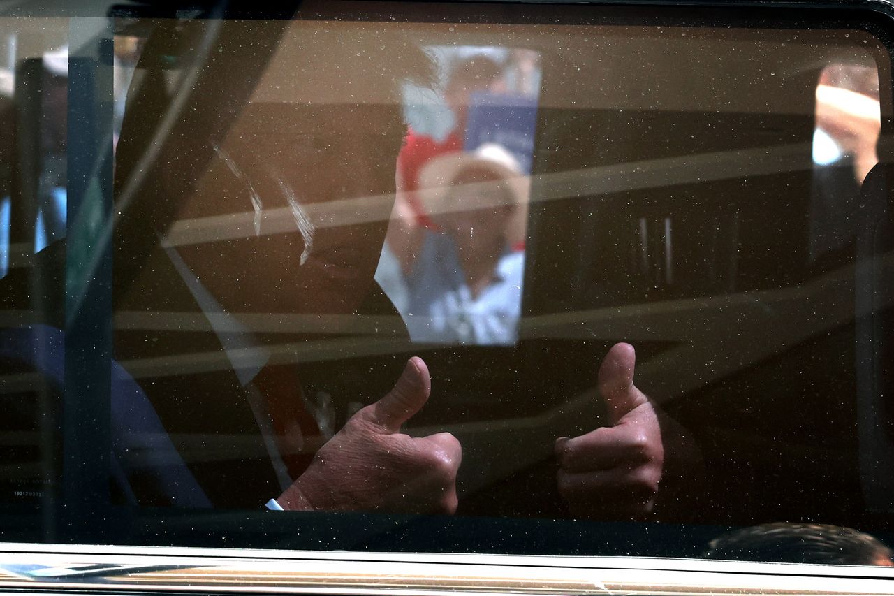 Trump gives a thumbs up as he departs the Wilkie D. Ferguson Jr. federal courthouse. 