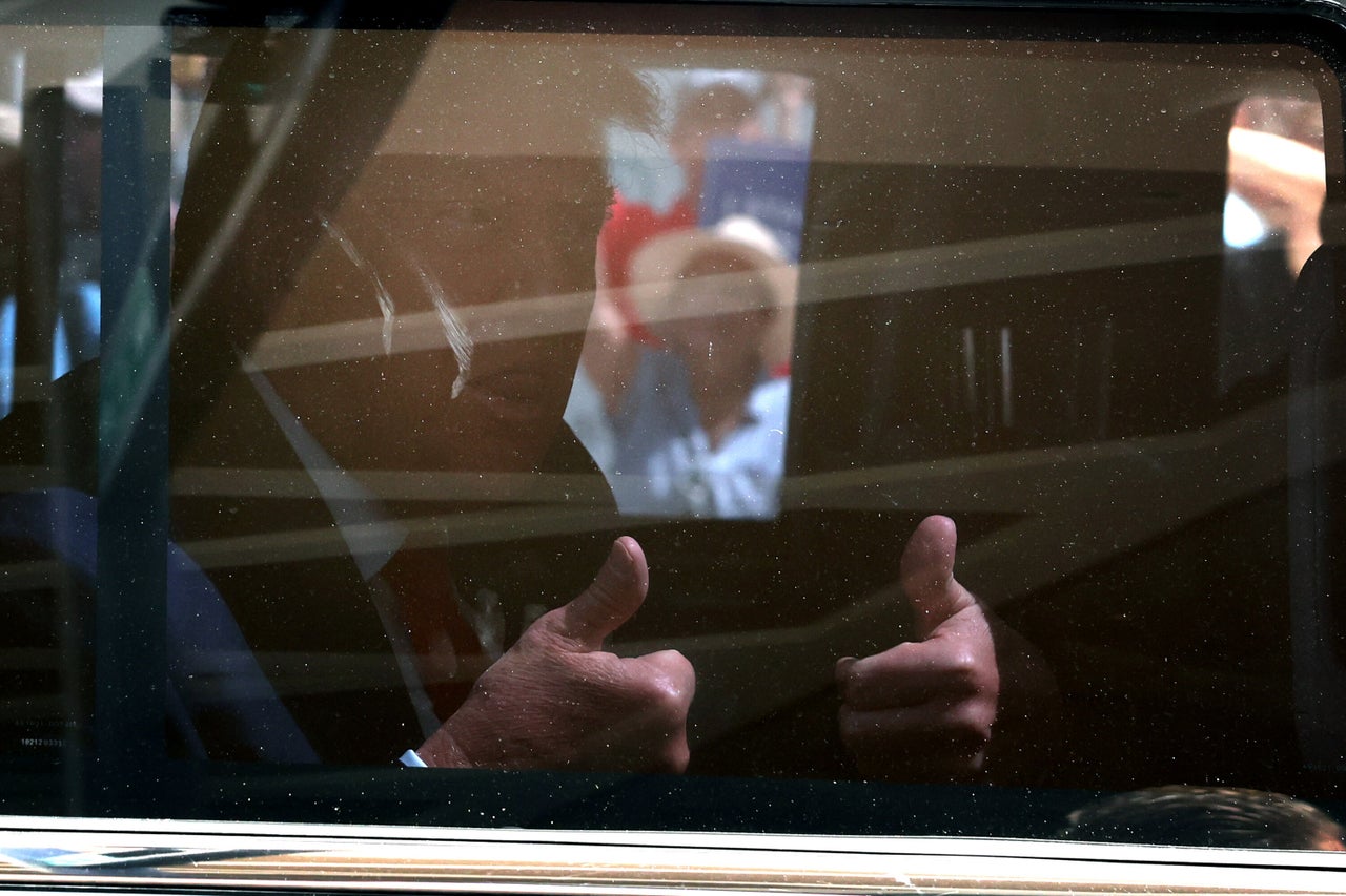 Trump gives a thumbs up as he departs the Wilkie D. Ferguson Jr. federal courthouse.