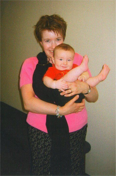 The author and her son with a (slipped) ring sling. "This is outside my office at the Gustafson Fine Arts Center at Bob Jones University in the summer or 2004," she writes.