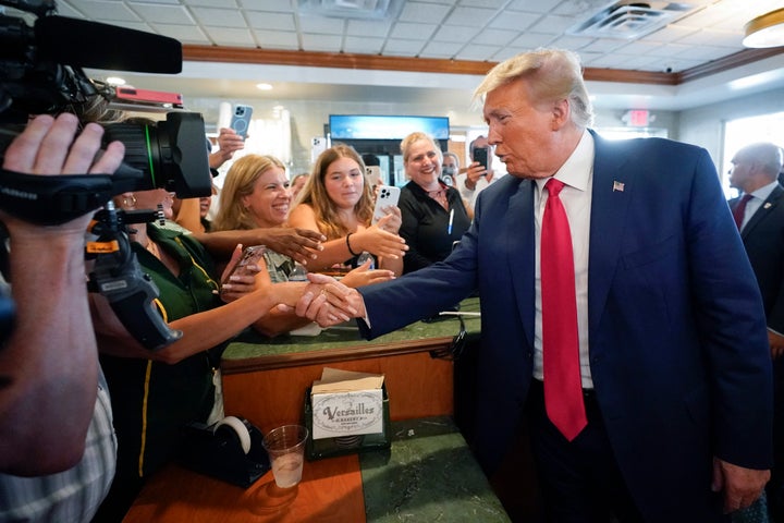 Former President Donald Trump greets supporters at Versailles restaurant on Tuesday, June 13, 2023, in Miami. Trump appeared in federal court Tuesday on dozens of felony charges accusing him of illegally hoarding classified documents and thwarting the Justice Department's efforts to get the records back. (AP Photo/Alex Brandon)