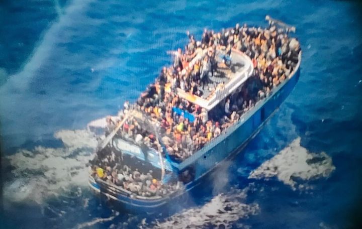 This undated handout image provided by Greece's coast guard on June 14, 2023, shows scores of people covering practically every free stretch of deck on a battered fishing boat that later capsized and sank off southern Greece.