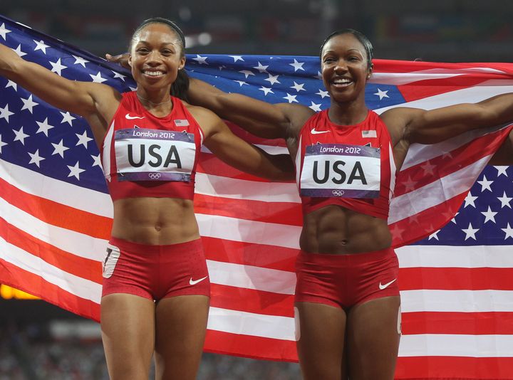 Tianna Madison (left) and Allyson Felix after winning the 4x100 relay in record time in 2012.