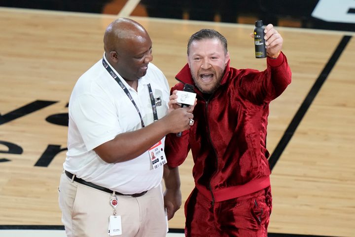 MMA fighter Conor McGregor promotes a health product during a break in Game 4 of the NBA Finals on June 9 in Miami.