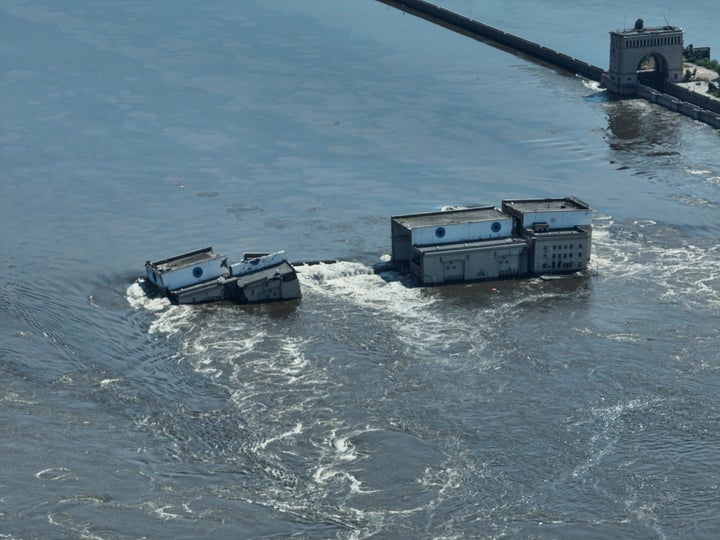 Water flows over the collapsed Kakhovka dam in Nova Kakhovka, in Russian-occupied Ukraine, Wednesday, June 7, 2023.