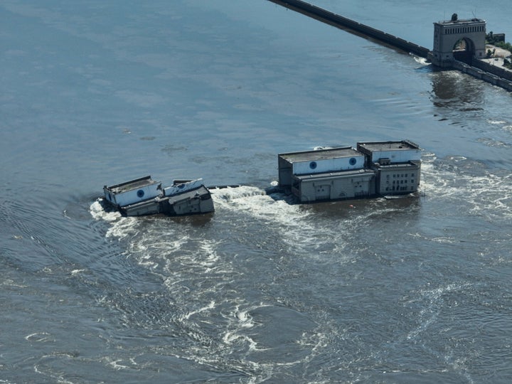 Water flows over the collapsed Kakhovka dam in Nova Kakhovka, in Russian-occupied Ukraine, Wednesday, June 7, 2023. 