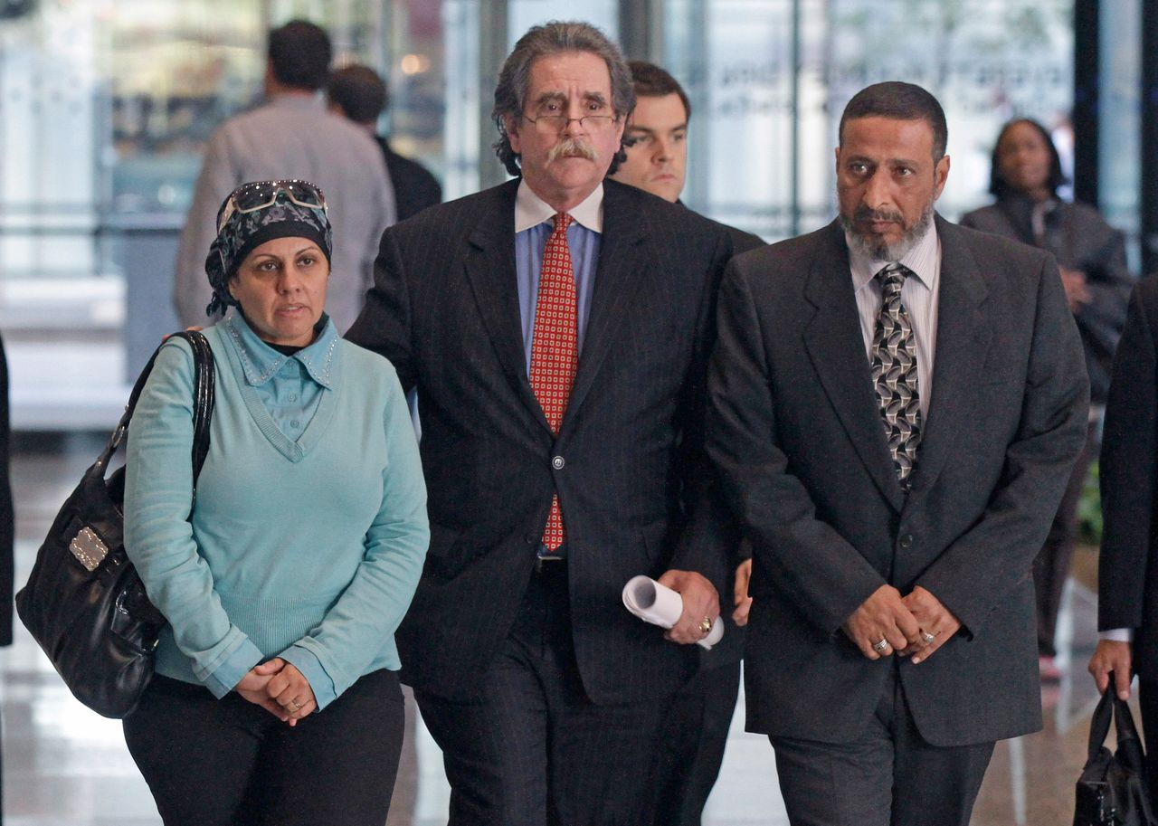 Attorney Thomas Durkin, center, leads Adel Daoud's parents, Mona and Ahmed, through a Chicago federal courthouse lobby on Oct. 11, 2015.