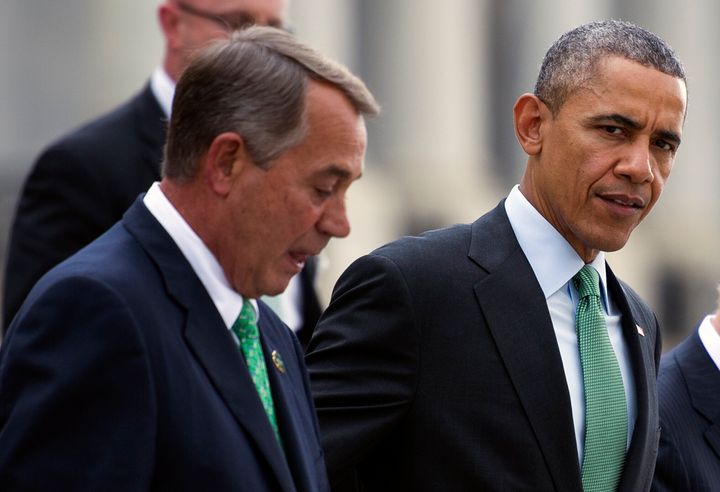 President Barack Obama and House Speaker John Boehner (R-Ohio) walk on Capitol Hill in Washington in 2015. The pair attempted to negotiate a sweeping budget deal in 2011. They ultimately failed.