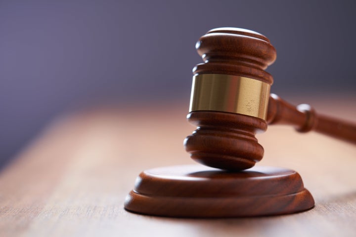 selective focus on gavel hammer on wooden table top with copy space