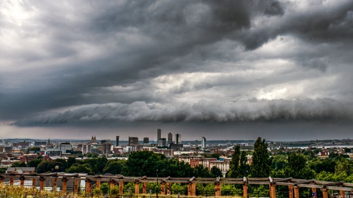 Storm clouds roll in over the city of Liverpool, Merseyside. More than half a month's worth of rain could fall in parts of the UK over the next 24 hours.