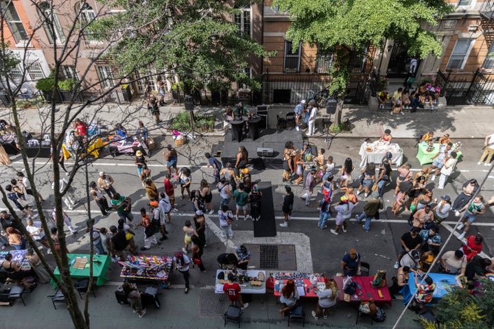 People attend the Queer Juneteenth Block Party, sponsored by The Center, on June 18, 2023, in New York. (AP Photo/Jeenah Moon)