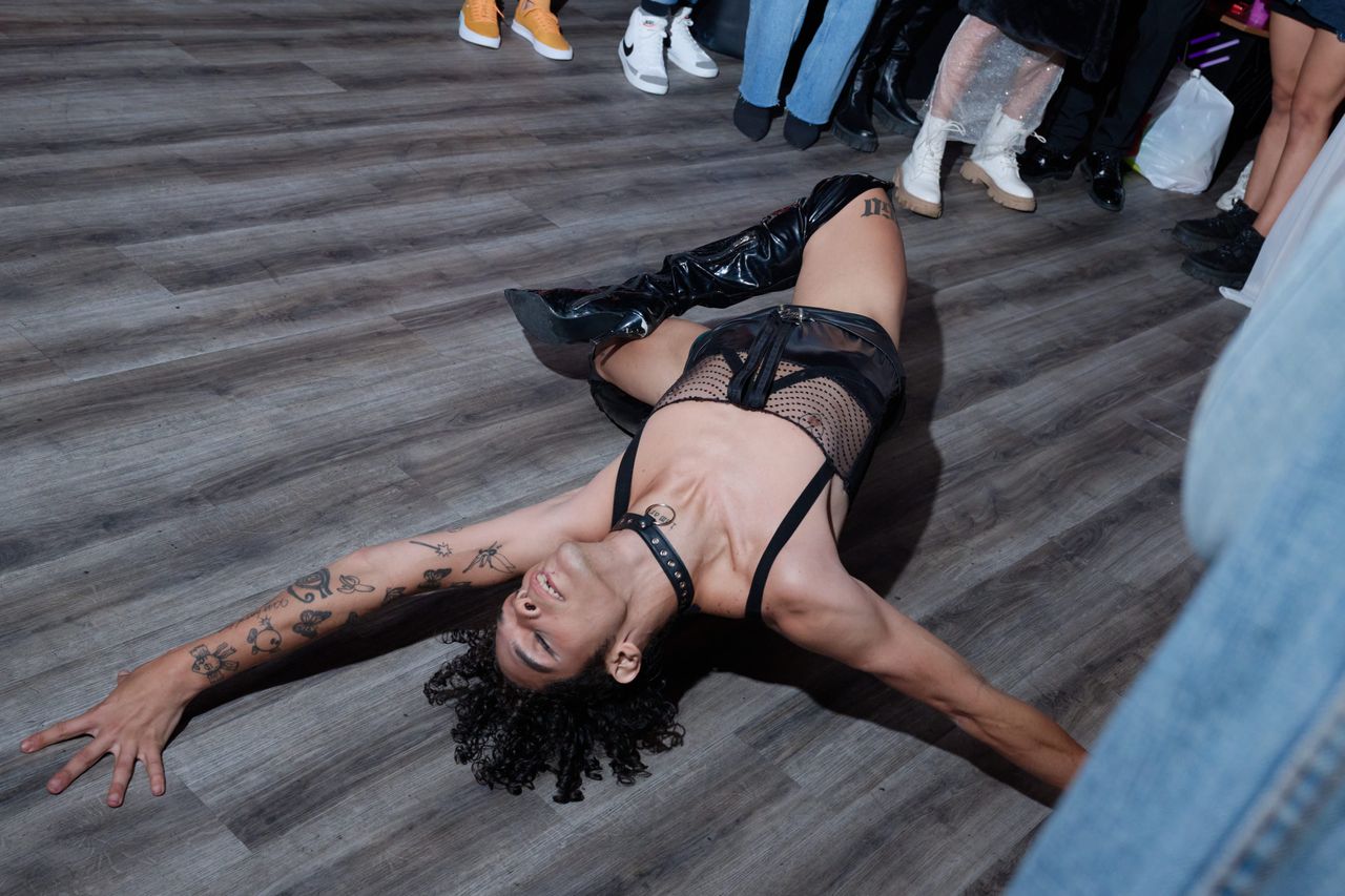 Mulan, the founder of the group House of Fantasy, performs a "death drop" at a ball hosted in a queer club in downtown Caracas, Venezuela.