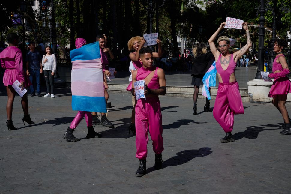 House of Fantasy members dance through a plaza during a shoot for the trans rights video campaign in Caracas.