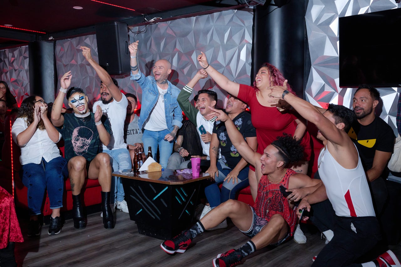 People from the drag, trans and voguing community cheer on the performers in a ball hosted at a queer club in downtown Caracas.