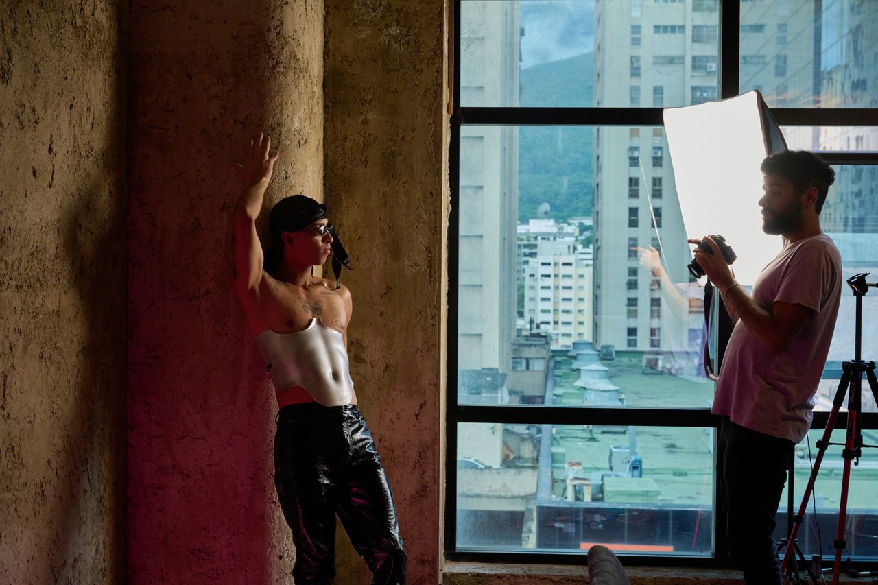 House of Fantasy members take turns poses for an indie clothing brand at El Casino in Caracas.