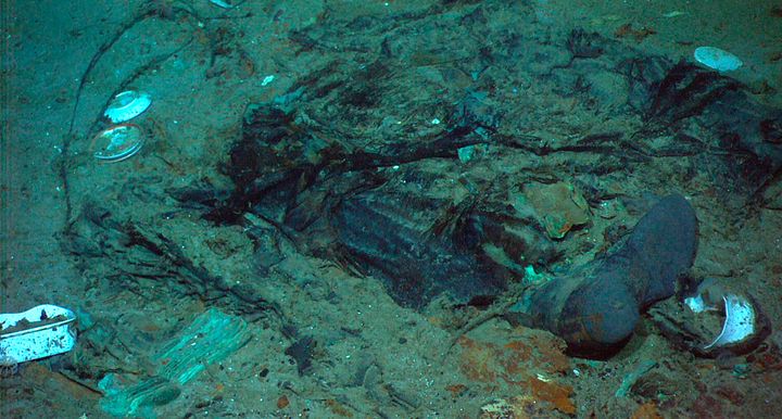 A 2004 photo shows the remains of a coat and boots in the mud on the sea bed near the Titanic's stern. 