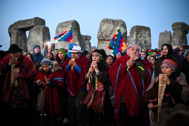 People play pan pipes at Stonehenge on June 21, 2023 in Wiltshire, England. 