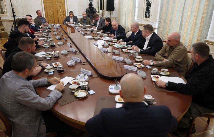 Russian President Vladimir Putin meets with war correspondents in Moscow on June 13, 2023.
