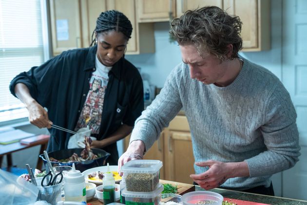 Sydney and Carmy test out recipes for the new restaurant in a scene from season two of The Bear.