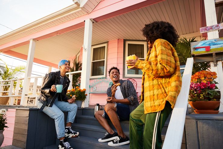 Individuals portrayed are modelsFriends convene on the steps of a house