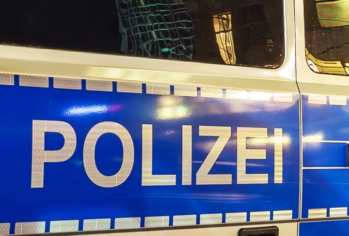 Police lettering on a police car at night