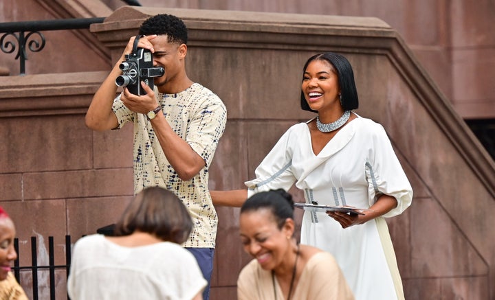 Keith Powers and Gabrielle Union are seen on the set of "The Perfect Find" in Harlem in July 2021.