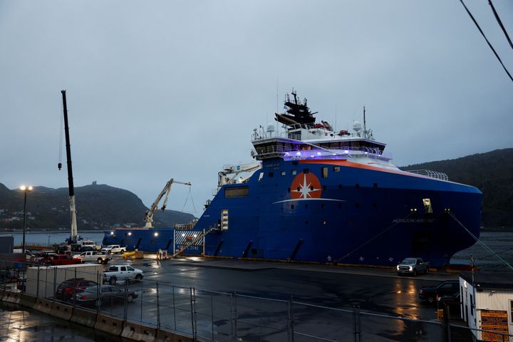 Equipment that was flown in by US Air Force transport planes is loaded onto the offshore vessel Horizon Arctic, before its deployment to the search area of a missing OceanGate Expeditions submersible which had been carrying five people to explore the sunken Titanic, in the port of St. John’s, Newfoundland.