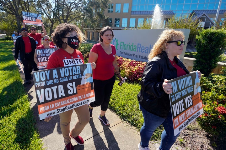 *Rent control advocates for Orange County demonstrate in front of the Florida Realtors office building Saturday, Oct. 22, 2022, in Orlando, Fla. (AP Photo/John Raoux)